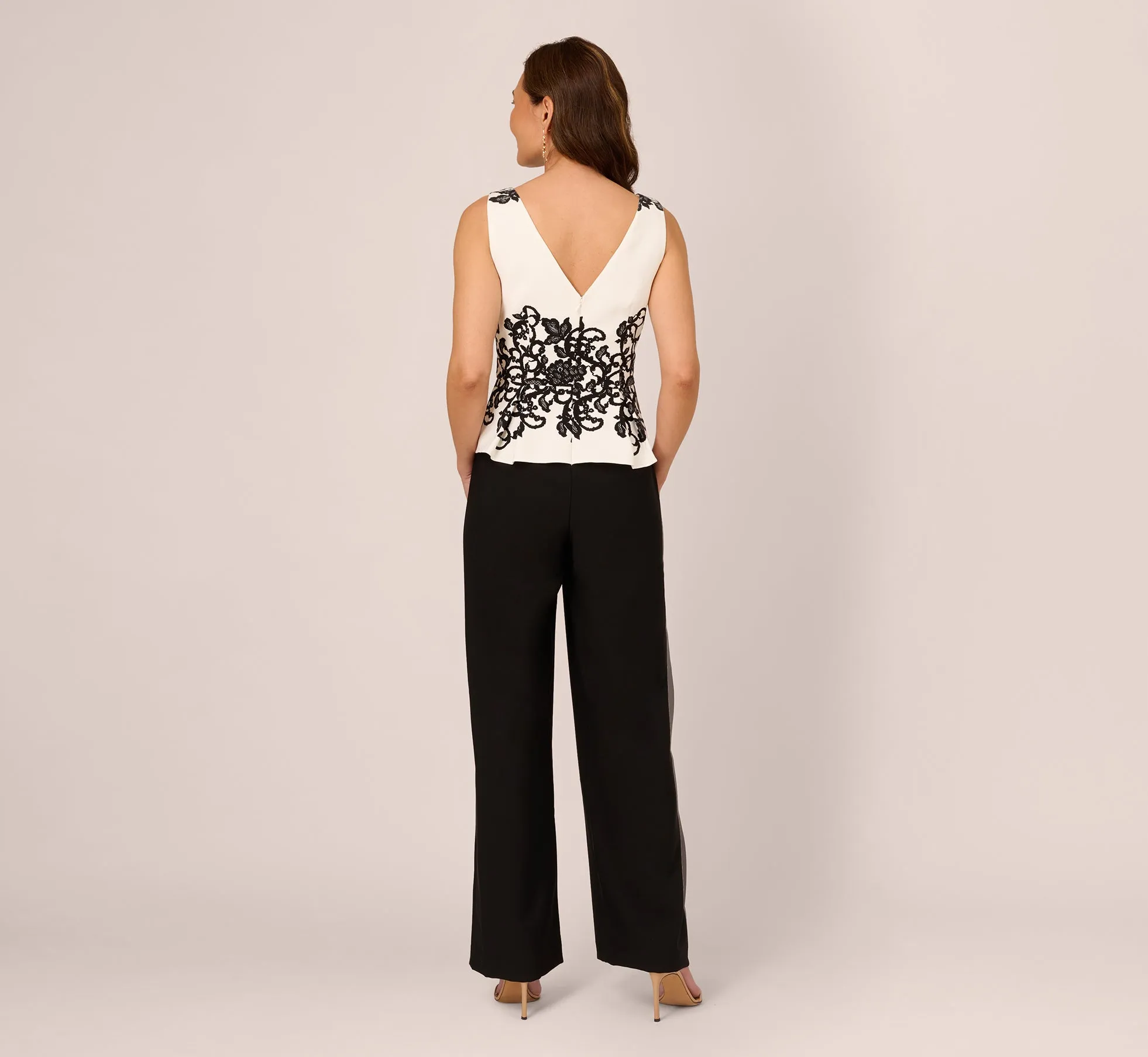 Sleeveless Peplum Jumpsuit With Scroll Lace Details In Ivory Black
