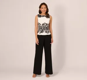 Sleeveless Peplum Jumpsuit With Scroll Lace Details In Ivory Black